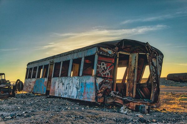 An abandoned train rusting in the Bolivian landscape
