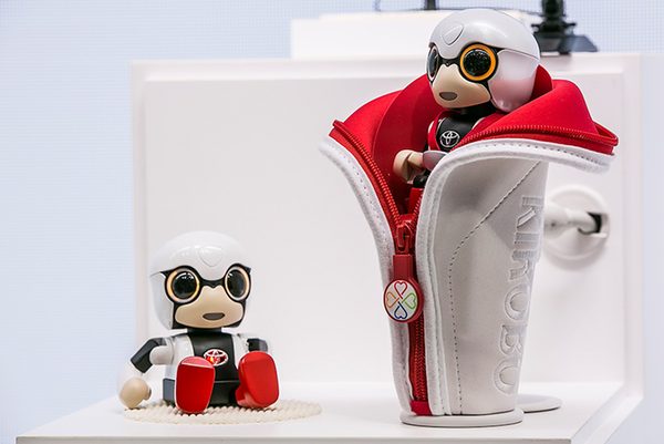 Toyota Kirobo Mini robot sitting in a car cup holder