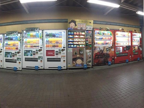A row of vending machines on a street in Japan