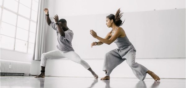 A dancer wearing a wireless motion sensor