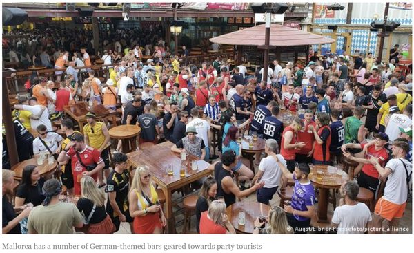 Crowds of young tourists partying at a beach resort destination