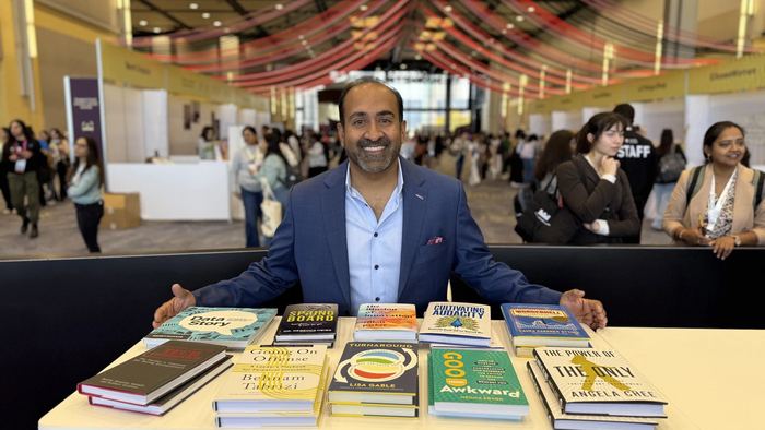 Rohit with a table of Ideapress books
