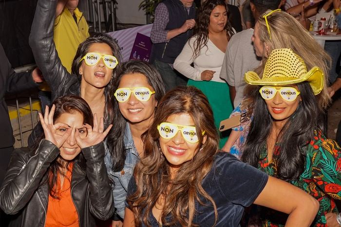 Guests in Non-Obvious glasses at a 7 Minute Meetup