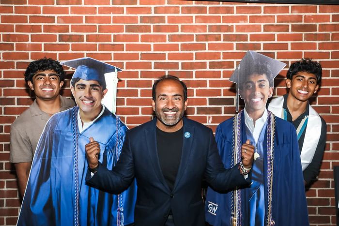 Rohit with his two sons at their graduation party